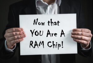 man holding sign that says Now that you are a RAM Chip