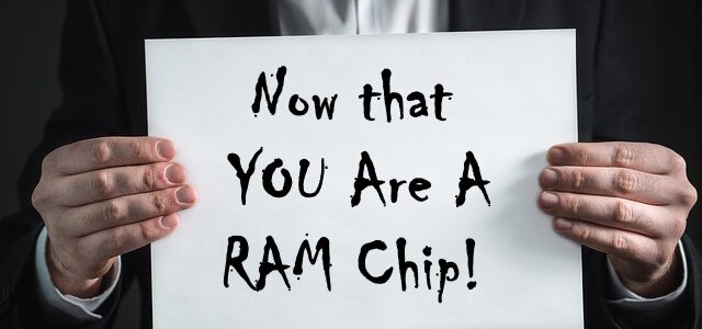 man holding sign that says Now that you are a RAM Chip