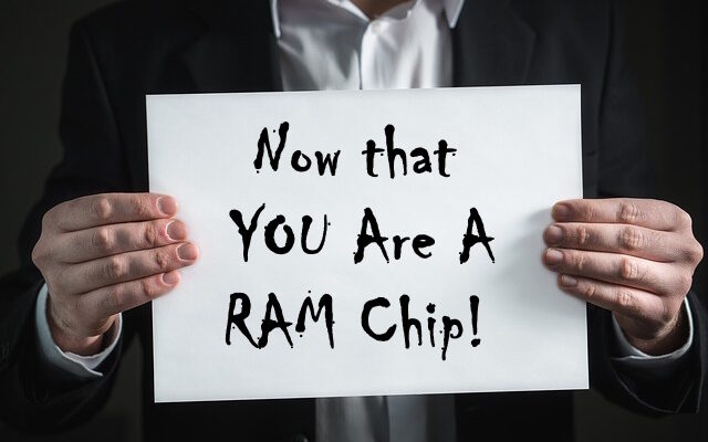 man holding sign that says Now that you are a RAM Chip